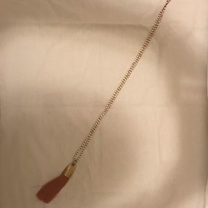 Orange tassel necklace. Never been worn